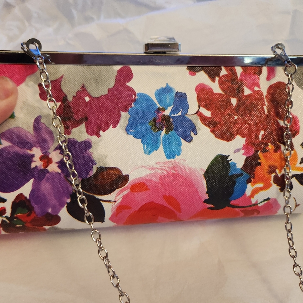 Fine Elegant crossbody clutch. Beautiful floral. Brand new without tag.